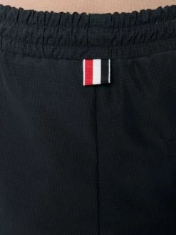 Thom Browne 4 Bar Stripe shell track pants performance track pants of women 9 Thom Browne 4-Bar Stripe shell track pants